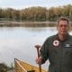 Jim Crigler by RIver with canoe